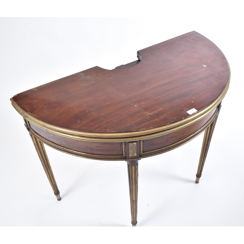 541 - A French Biedermeier 19th century mahogany and brass bound games / card table or roulette table. The... 