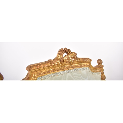 352 - A 19th century French Louis XVI gilt wood fauteuil bergere lounge armchair. The chair having a torch... 