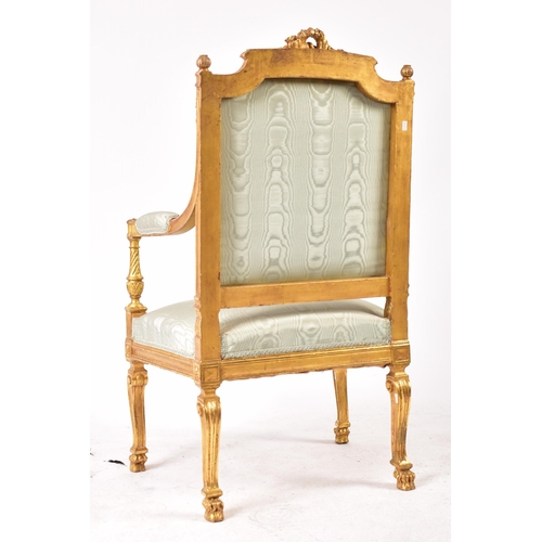 352 - A 19th century French Louis XVI gilt wood fauteuil bergere lounge armchair. The chair having a torch... 