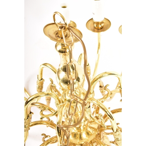 546 - A large 21st century brassed chrome metal and acrylic two tier twelve arms chandelier ceiling light.... 