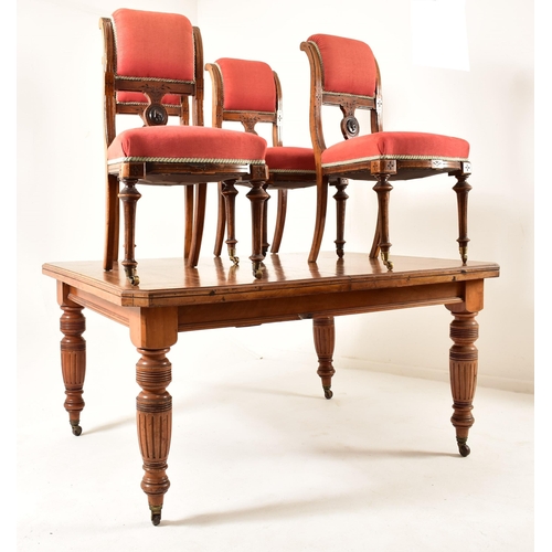 547 - A Victorian 19th century mahogany twin leaf extending dining table together with a set of harlequin ... 