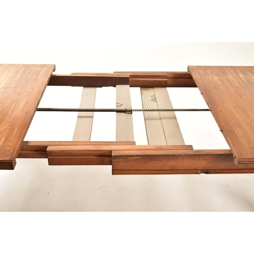 547 - A Victorian 19th century mahogany twin leaf extending dining table together with a set of harlequin ... 