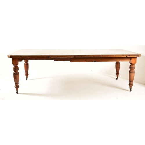 547 - A Victorian 19th century mahogany twin leaf extending dining table together with a set of harlequin ... 