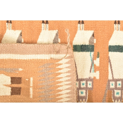 557 - A Native American/Navajo/Yei Bi Chai woven rug/wall hanging. The rug depicting seven Yei Bi Chei dan... 