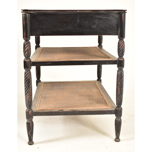 364 - An ebonised mahogany whatnot etagere table in the Aesthetic Movement manner. The table having a shap... 