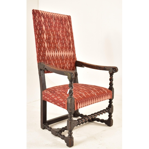 559 - A Continental late 18th century carved oak throne hall armchair. The armchair having a squared uphol... 