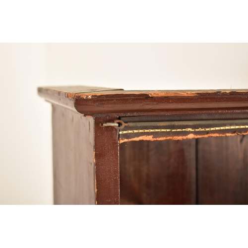 563 - A large 19th century floor standing mahogany upright bookcase. The bookcase having a flared pediment... 