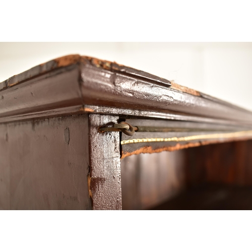 563 - A large 19th century floor standing mahogany upright bookcase. The bookcase having a flared pediment... 