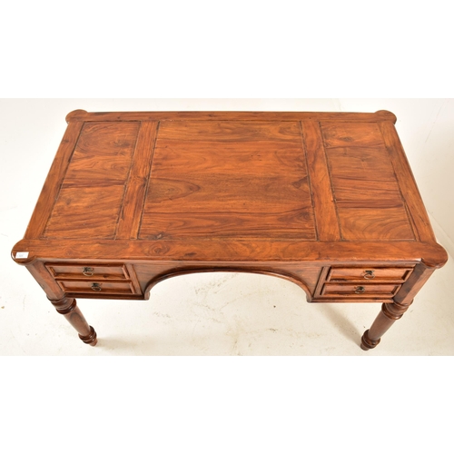 565 - A French inspired walnut writing desk table with chair. The desk having a shaped top with panels det... 