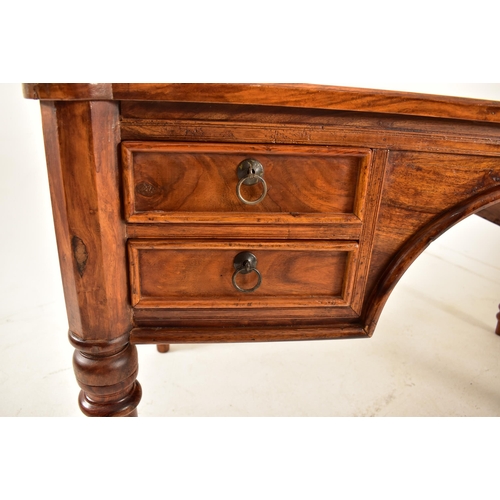 565 - A French inspired walnut writing desk table with chair. The desk having a shaped top with panels det... 