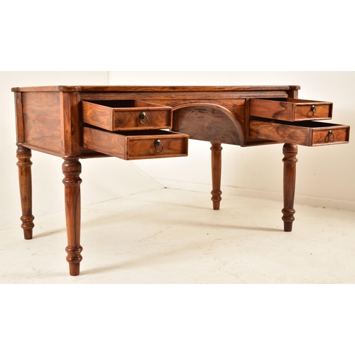 565 - A French inspired walnut writing desk table with chair. The desk having a shaped top with panels det... 