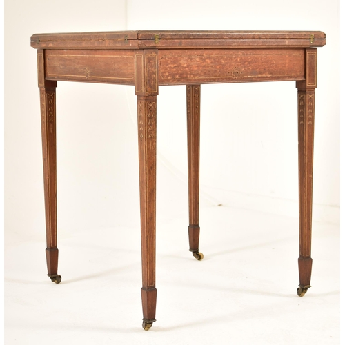 571 - An Edwardian oak & gilt detailed envelope card / game table. The table having a squared folding enve... 