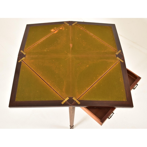 571 - An Edwardian oak & gilt detailed envelope card / game table. The table having a squared folding enve... 