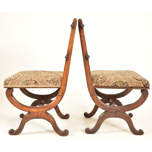 379 - A pair of late 19th century carved oak Gothic inspired Aesthetic Movement dining chairs. Each chair ... 