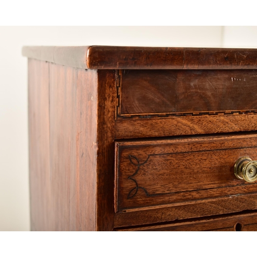 382 - A George III 19th century mahogany chest of drawers. The chest having a chamfered top over a central... 