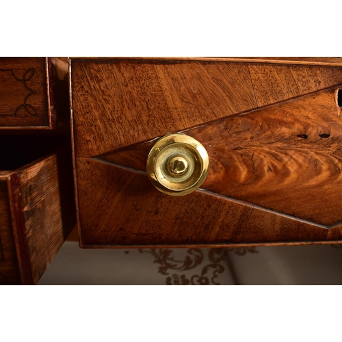 382 - A George III 19th century mahogany chest of drawers. The chest having a chamfered top over a central... 