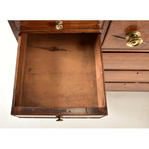 382 - A George III 19th century mahogany chest of drawers. The chest having a chamfered top over a central... 