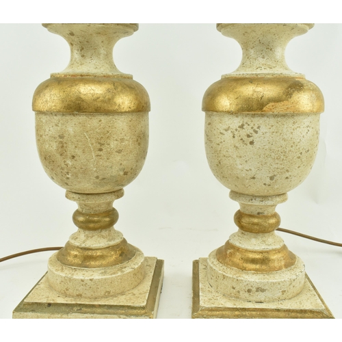 575 - Porta Romana - A pair of gold & cream aged effect wooden desk table lamps in the shape of urns. Each... 