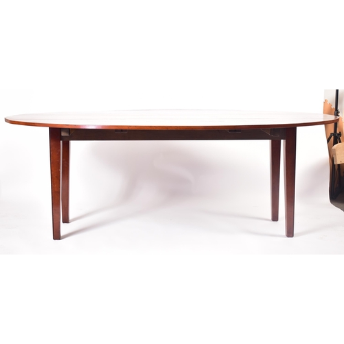 576 - A large 20th century George III influenced mahogany wake / hunt table. The table of elongated form w... 