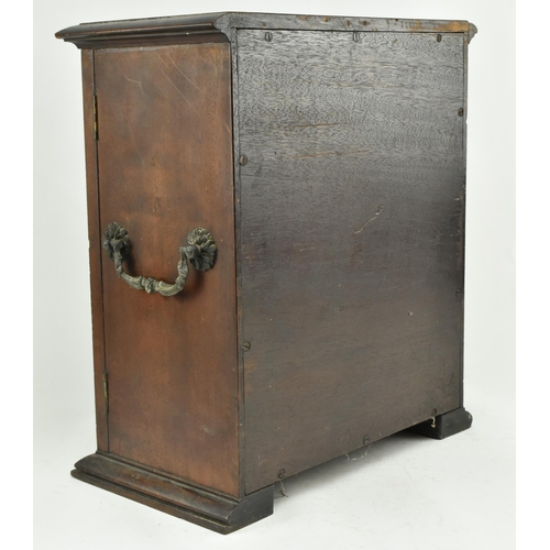 383 - An early 20th century mahogany watchmakers specimen chest cabinet. The cabinet having a chamfered fl... 