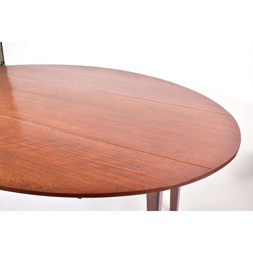 576 - A large 20th century George III influenced mahogany wake / hunt table. The table of elongated form w... 