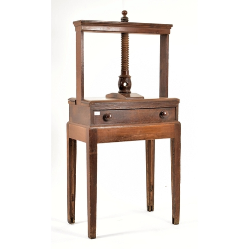 384 - A George III 18th century oak book press on table stand. The press having a large upright central wo... 