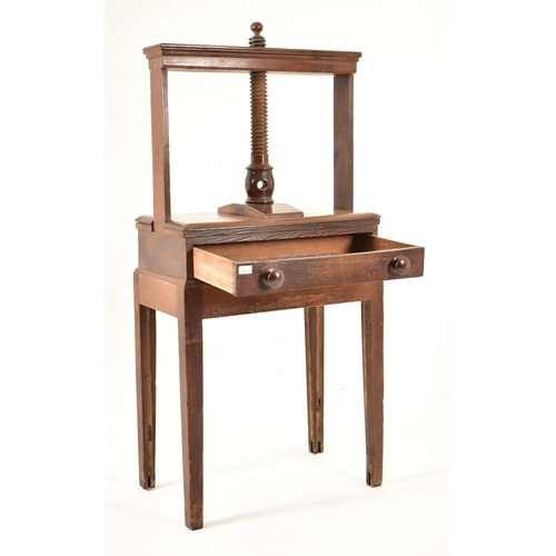 384 - A George III 18th century oak book press on table stand. The press having a large upright central wo... 