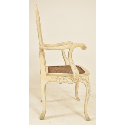 579 - A Swedish early 20th century hand painted wooden easy chair armchair. The chair having a pierced sha... 