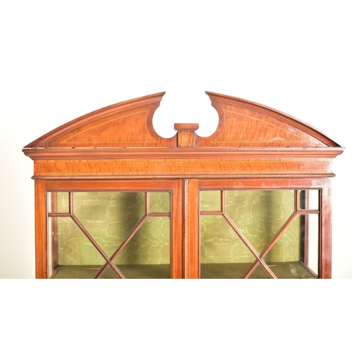 583 - An Edwardian mahogany china display bookcase cabinet vitrine on stand. The cabinet having an astraga... 