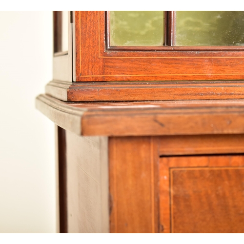 583 - An Edwardian mahogany china display bookcase cabinet vitrine on stand. The cabinet having an astraga... 