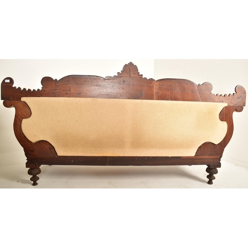 390 - A 19th century Anglo Colonial scroll ended chaise lounge / sofa settee. The chaise having a carved m... 