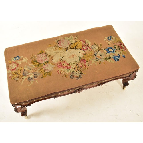 584 - A Victorian 19th century carved mahogany upholstered rectangular ottoman seat. The ottoman having a ... 