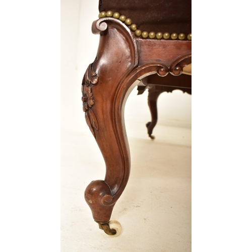 584 - A Victorian 19th century carved mahogany upholstered rectangular ottoman seat. The ottoman having a ... 