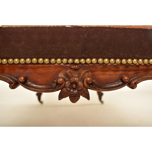 584 - A Victorian 19th century carved mahogany upholstered rectangular ottoman seat. The ottoman having a ... 