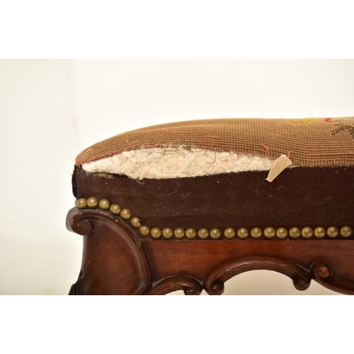 584 - A Victorian 19th century carved mahogany upholstered rectangular ottoman seat. The ottoman having a ... 