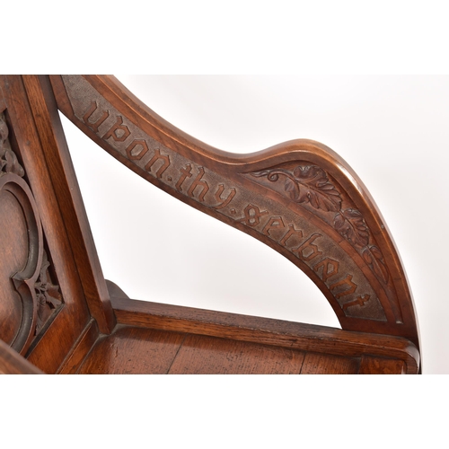 392 - A Victorian 19th century carved oak Glastonbury chair. The chair having a squared frame with shaped ... 