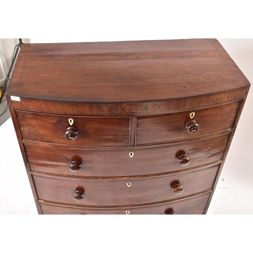 393 - A 19th century George III bow front line inlaid mahogany chest of drawers. Raised on French kick fee... 