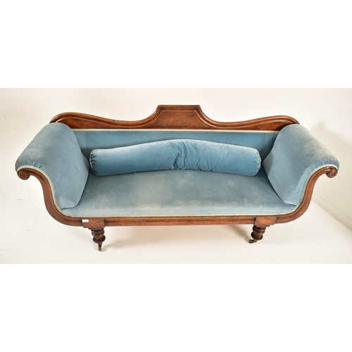 394 - A Victorian 19th century double scroll end Chesterfield mahogany framed sofa. The sofa having a shap... 