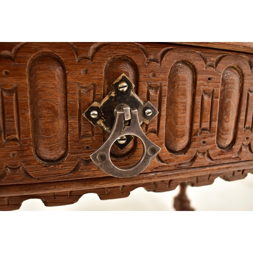 591 - A 19th century Continental Flemish / Dutch oak cup & cover writing table. The table having a chamfer... 