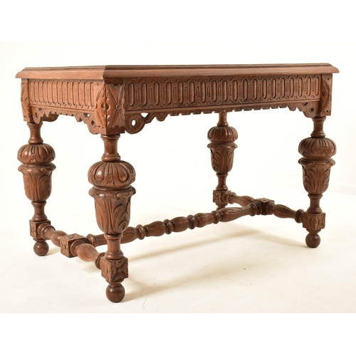 591 - A 19th century Continental Flemish / Dutch oak cup & cover writing table. The table having a chamfer... 