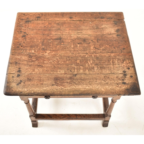 594 - A George III 18th century oak side low table. The table having a squared flared top over a twin hand... 