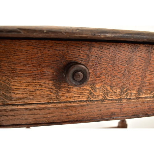 594 - A George III 18th century oak side low table. The table having a squared flared top over a twin hand... 