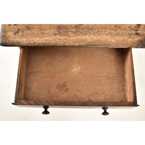 594 - A George III 18th century oak side low table. The table having a squared flared top over a twin hand... 