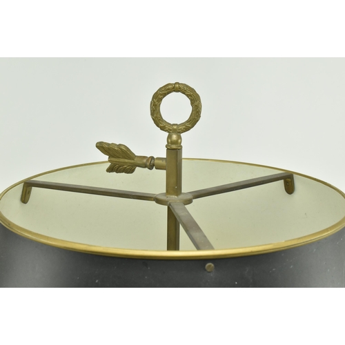 595 - A French brass bouillotte desk lamp light. The lamp having a garland shape carrying ring atop over a... 