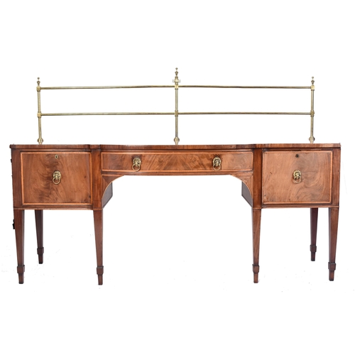 403 - A late 18th century George III Sheraton manner sideboard credenza. Raised on square tapering legs wi... 