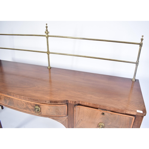 403 - A late 18th century George III Sheraton manner sideboard credenza. Raised on square tapering legs wi... 