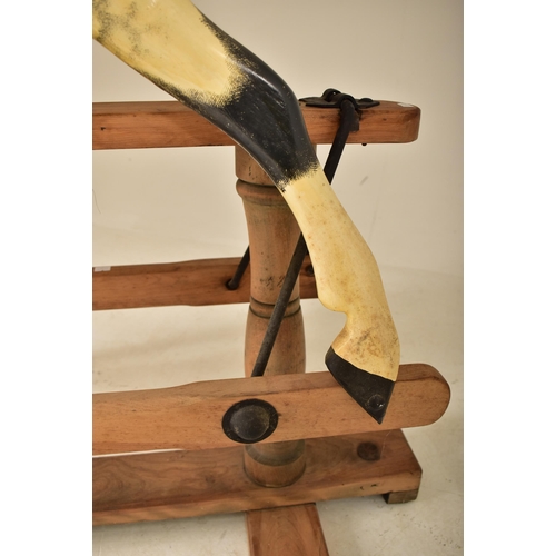 601 - G & J Lines Brothers - A vintage early 20th century rocking horse. The horse with hand painted finis... 