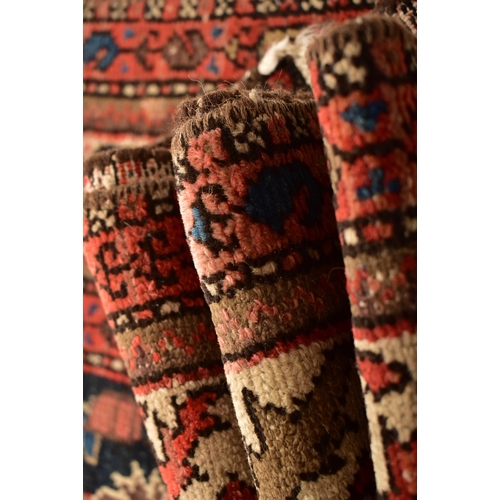 604 - An early 20th century Persian Islamic Maleyer floor carpet runner rug. The rug having a central blac... 