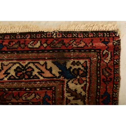 604 - An early 20th century Persian Islamic Maleyer floor carpet runner rug. The rug having a central blac... 