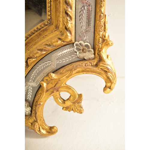 605 - A large Italian Venetian 19th century gilt gesso & wood wall hanging mirror. The mirror having an in... 